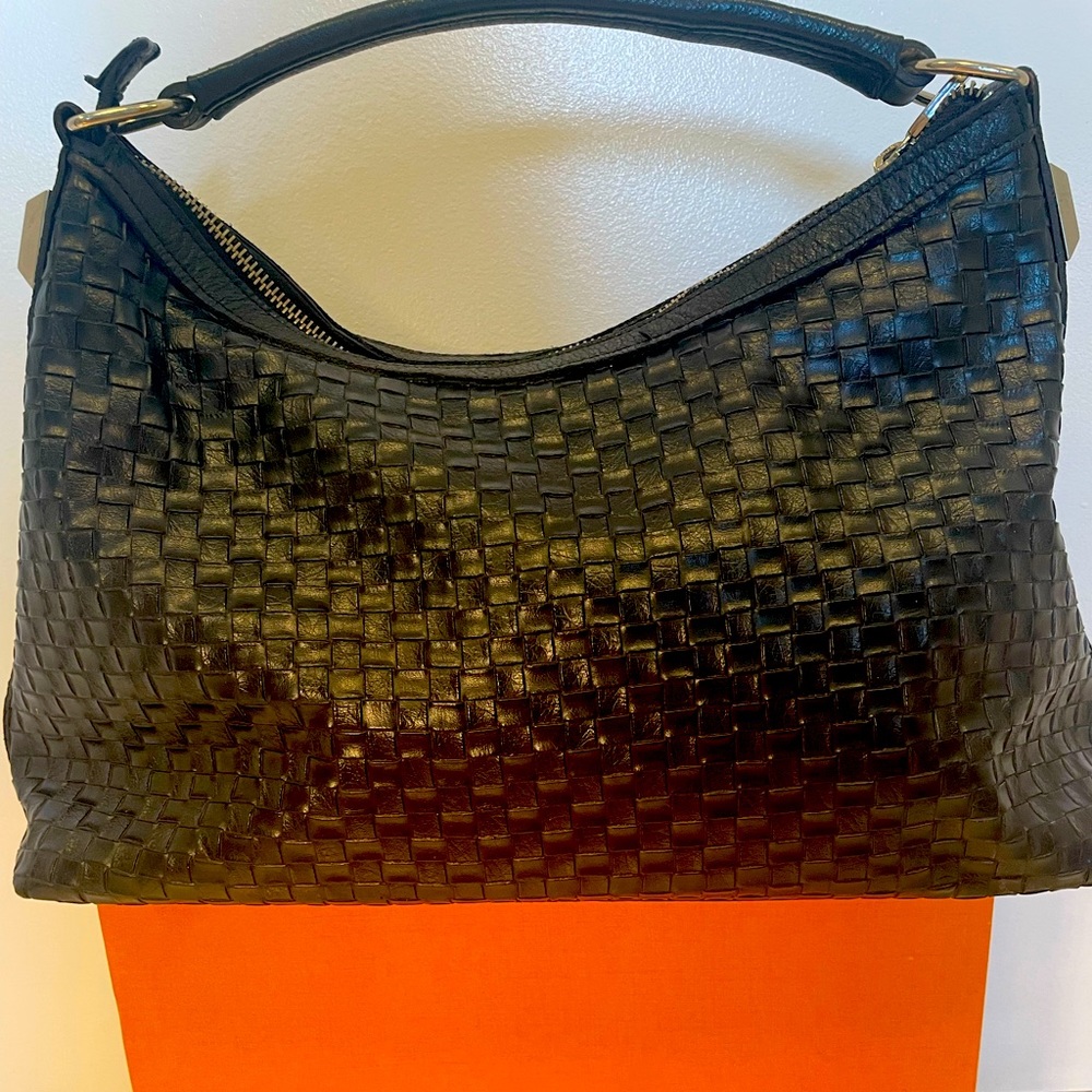 Beautiful Prune handbag in good condition. 14 inches long.